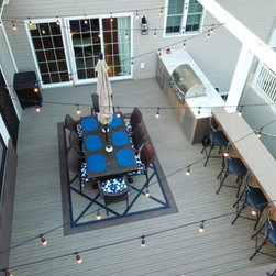 Voyage Decking in Khaya and Costa with Picture Frame Board on Dark Slate - Deck Tiles And Planks