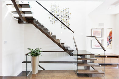 Staircase - contemporary wooden u-shaped open and glass railing staircase idea in Toronto
