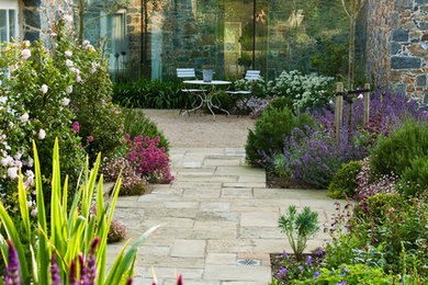 This is an example of a mediterranean garden in Other with with path.