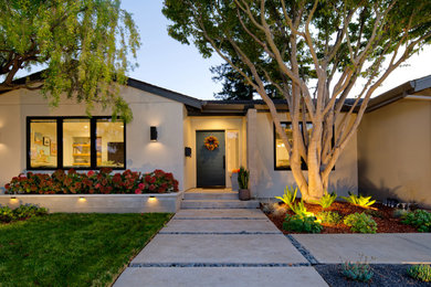 Inspiration for a mid-sized contemporary gray stucco exterior home remodel in San Francisco with a shingle roof and a gray roof