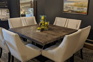 Small transitional medium tone wood floor and brown floor enclosed dining room photo in Chicago with gray walls and no fireplace
