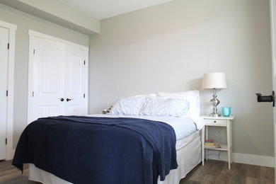 Inspiration for a beach style bedroom in Vancouver with grey walls.