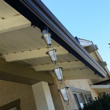 Triple Curve Rain Gutter in Black Aluminum.