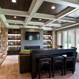 Photo of a large rustic walk-out basement in Other with beige walls, carpet and a ribbon fireplace.