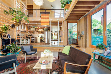Living room - contemporary loft-style concrete floor living room idea in Portland with a wood stove and no tv