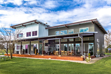 Inspiration for a mid-sized contemporary white one-story metal flat roof remodel in Austin