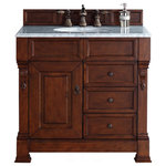 James Martin Vanities - Brookfield 36" Single Vanity, Warm Cherry w/ 3 CM Arctic Fall Solid Surface Top - The Brookfield 36" Warm Cherry vanity by James Martin Vanities features hand carved accenting filigrees and raised panel doors. One door opens to shelves for storage below. Two drawers made up of a lower double-height drawer and a middle standard drawer offer additional storage space. Antique brass finish door and drawer pulls. Matching wood backsplash is included. The look is completed with a 3cm eased edge Arctic Fall Solid Surface top with a white porcelain rectangular sink.