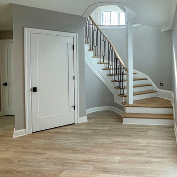 Project #95 | Freestanding Elliptical Staircase with Geometric Iron Balusters