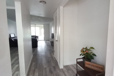 Inspiration for a large transitional entryway remodel in Miami with white walls