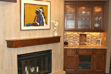 Mid-sized elegant open concept dark wood floor family room photo in Denver with a bar, beige walls, a standard fireplace, a tile fireplace and no tv