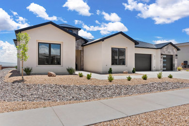 Mid-sized minimalist one-story stucco exterior home photo in Albuquerque