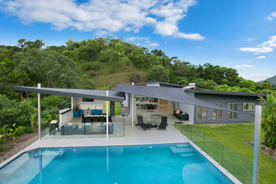 Example of a large trendy home design design in Cairns