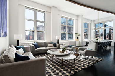 Example of a mid-sized trendy open concept dark wood floor living room design in New York with white walls