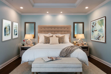 Bedroom - mid-sized transitional master medium tone wood floor and brown floor bedroom idea in Los Angeles with green walls