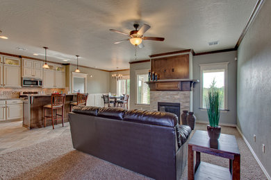 Family room - traditional open concept carpeted family room idea in Oklahoma City with green walls, a standard fireplace, a tile fireplace and a wall-mounted tv