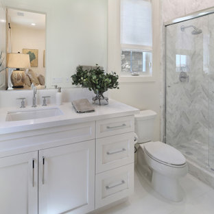 Mid-sized modern guest bedroom in Orange County with white walls, marble floors and white floor.
