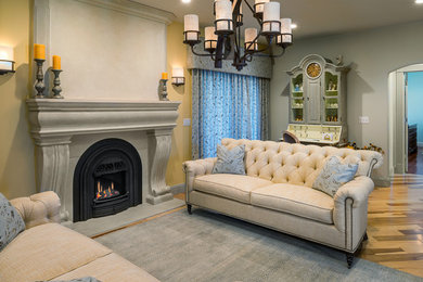 Living room - large transitional formal and open concept medium tone wood floor living room idea in Providence with multicolored walls, a stone fireplace and no tv