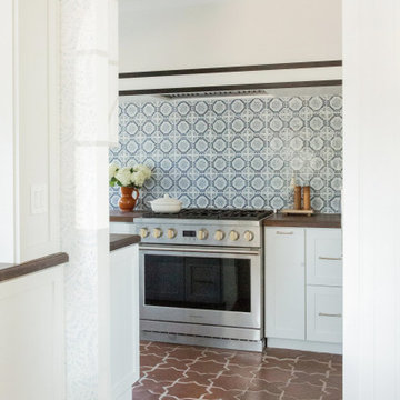 Warm Spanish-Style Kitchen with Artisan Tile Backsplash
