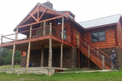 Mountain style home design photo in Other