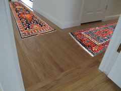 Positioning of 2 runner rugs in L-shaped hallway? Does it matter?