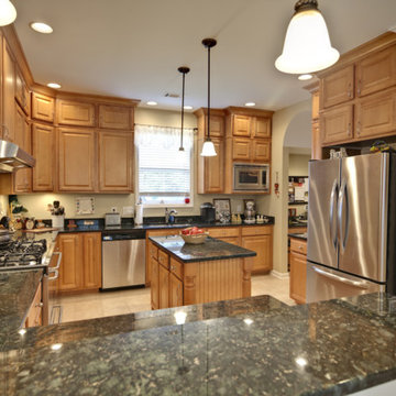 Green Butterfly granite countertop with 4" back splashes
