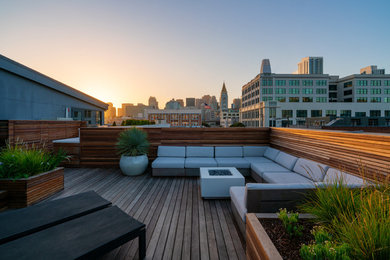 Design ideas for a small modern full sun rooftop landscaping in San Francisco with a fire pit and decking.