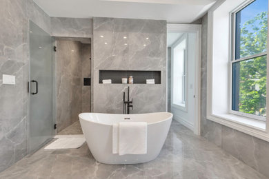 Huge trendy master gray tile and porcelain tile porcelain tile, gray floor and double-sink bathroom photo in New York with flat-panel cabinets, distressed cabinets, a wall-mount toilet, gray walls, a drop-in sink, quartz countertops, a hinged shower door, white countertops and a built-in vanity