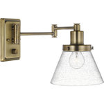 Progress Lighting - Hinton Collection Vintage Brass Swing Arm Wall Light - Enjoy focused task lighting with the industrial demeanor of this one-light swing arm wall bracket. A clear seeded glass shade is ready to provide you with focused task light wherever illumination is called upon. The light fixture's signature adjustable arm is coated in a vintage brass finish and makes this wall light a favorite choice for when you want to read your favorite novel before bed.