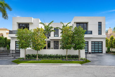 Example of a trendy white exterior home design in Miami