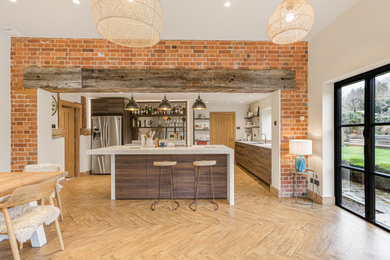 Photo of a medium sized rustic kitchen in Buckinghamshire with an island.