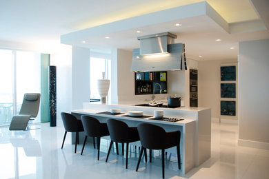 Inspiration for a mid-sized contemporary open concept porcelain tile and white floor living room remodel in Miami with beige walls and a media wall