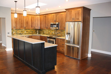 Large elegant u-shaped dark wood floor and brown floor eat-in kitchen photo in Chicago with a drop-in sink, recessed-panel cabinets, dark wood cabinets, quartz countertops, beige backsplash, ceramic backsplash, stainless steel appliances and an island