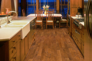 Inspiration for a large craftsman galley dark wood floor and brown floor eat-in kitchen remodel in Phoenix with a double-bowl sink, shaker cabinets, dark wood cabinets, granite countertops, stainless steel appliances, an island and beige countertops