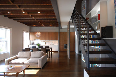 Staircase - large modern wooden floating open and cable railing staircase idea in New York