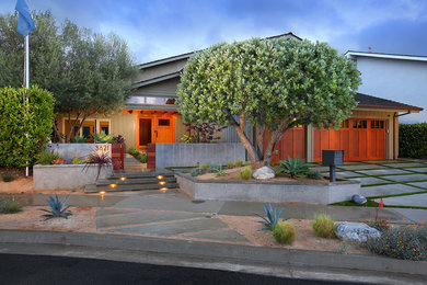 Photo of a large contemporary split-level grey exterior in Orange County.
