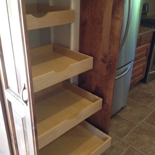 Photo of an arts and crafts kitchen pantry in Toronto with shaker cabinets, medium wood cabinets and travertine floors.