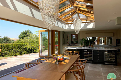 Large contemporary conservatory in Sussex with a glass ceiling.