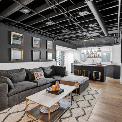 Example of a large trendy basement design in Chicago with black walls