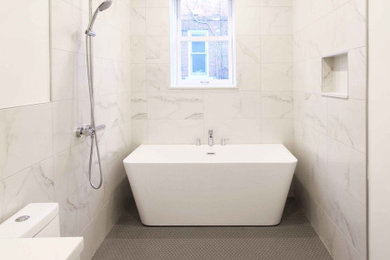 Inspiration for a modern white tile and porcelain tile porcelain tile, gray floor and single-sink bathroom remodel in Montreal with flat-panel cabinets, white cabinets, a one-piece toilet, beige walls, quartz countertops, white countertops, a niche and a floating vanity
