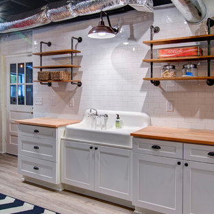 Inspiration for a medium sized urban walk-out basement in Atlanta with white walls, vinyl flooring and no fireplace.