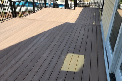 Inspiration for a mid-sized backyard metal railing deck remodel in Boston with no cover