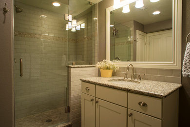 Inspiration for a small transitional gray tile and ceramic tile single-sink alcove shower remodel in Other with recessed-panel cabinets, white cabinets, gray walls, an undermount sink, granite countertops, a hinged shower door and multicolored countertops