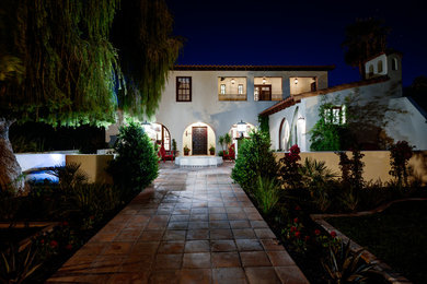 Inspiration for a mediterranean white two-story exterior home remodel in Phoenix