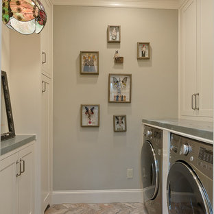 This is an example of a medium sized classic galley utility room in Houston with beige cabinets, zinc worktops, grey walls, brick flooring and a side by side washer and dryer.