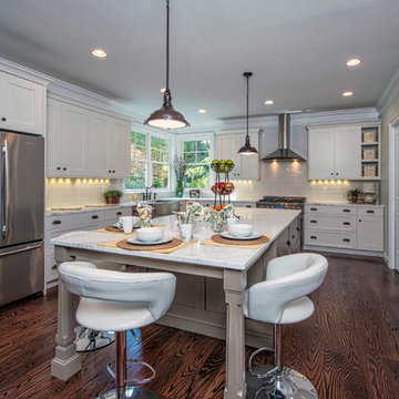 Bright White Kitchen with Stainless Steel Appliances and Oversized Island