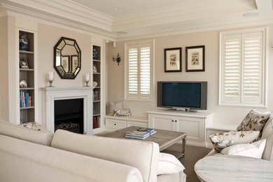 Mid-sized country enclosed living room in Sydney with beige walls.