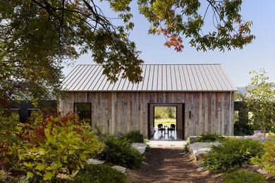 Cottage one-story wood gable roof idea in San Francisco
