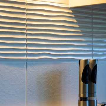 The textured tiles add to the overall effect with muted colours and textural con
