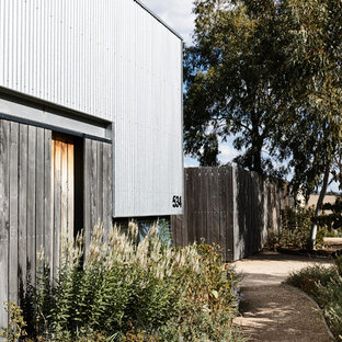 Design ideas for a contemporary front yard garden in Melbourne with a garden path and gravel.