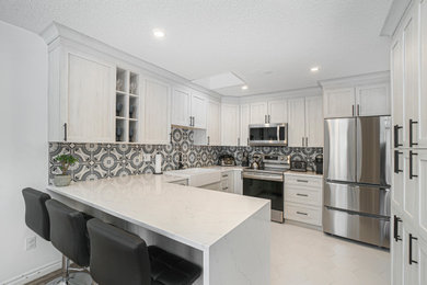 Trendy kitchen photo in Ottawa with shaker cabinets